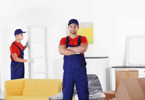 Furniture removal team handling a sofa move in Roehampton