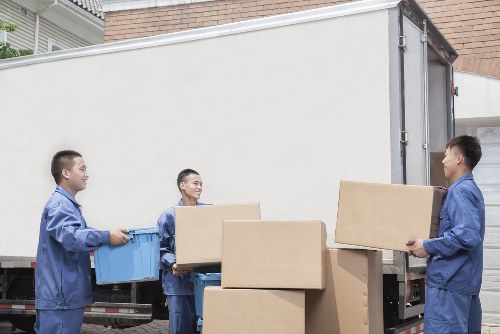 Professional movers transporting office furniture in southwest London