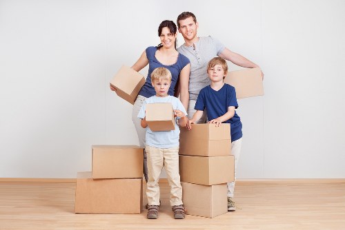 Local moving team handling boxes and furniture near Roehampton homes