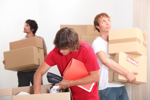 Packed moving truck and boxes prepared for local transport