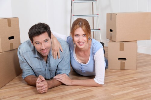 Packed moving boxes and furniture ready for transport in Roehampton