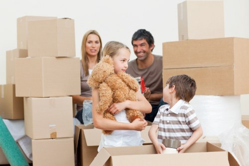 Office removal team organising desks and boxes for a business relocation in Roehampton